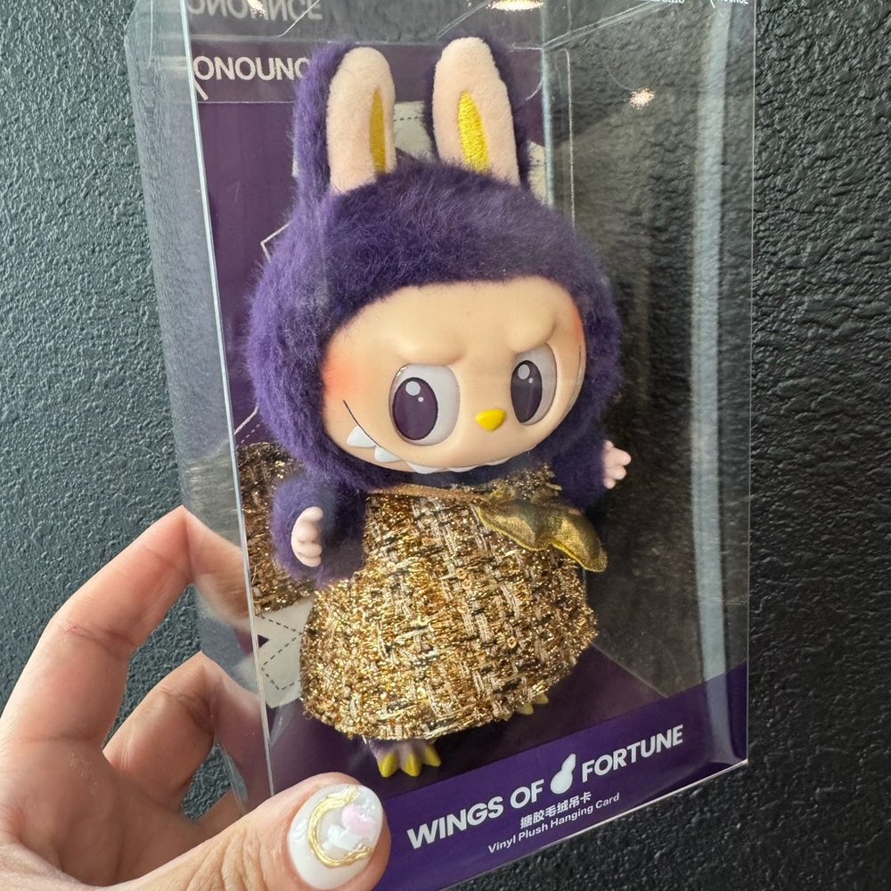 Purple Hooded Figure with Gold Outfit